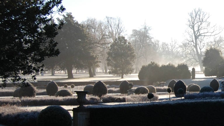 The Dutch Gardens at Belton in early morning mist
